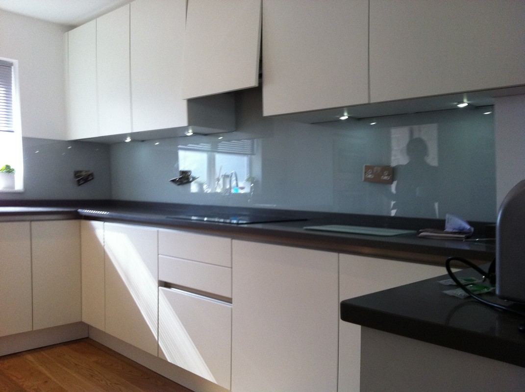 Grey glass kitchen splashback with LED lighting in Herne Hill