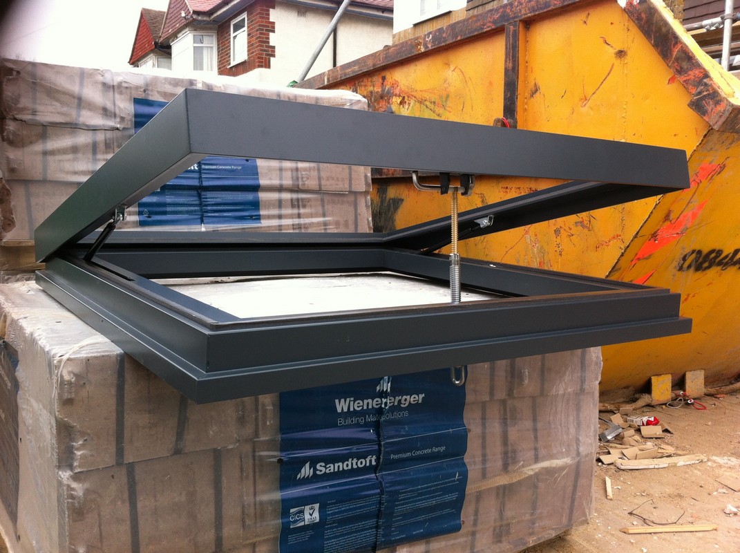 Opening flat roof skylight in anthracite grey installed in Herne Hill