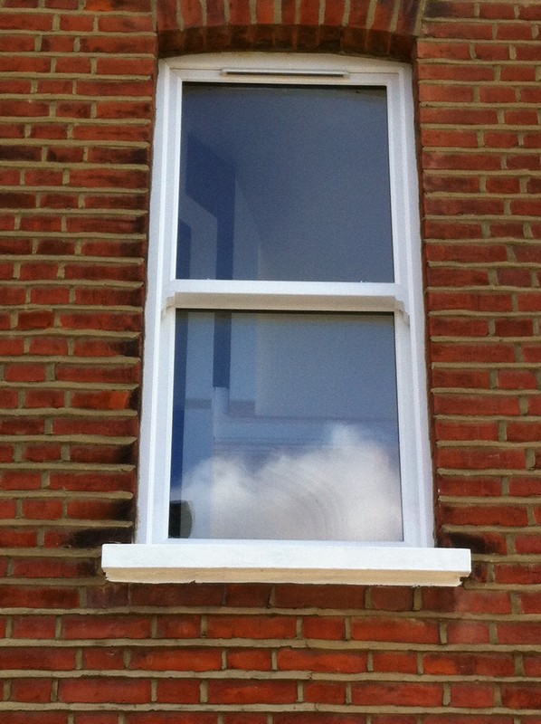 uPVC sash window on Victorian red brick house in Herne Hill